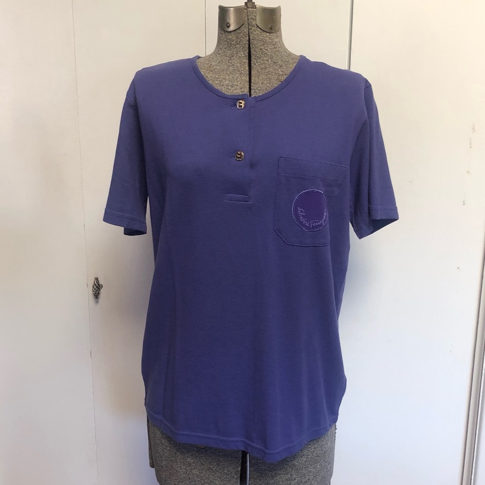 Purple Ferragamo crew neck top w/2 two-tone buttons & pocket w/insignia on front
